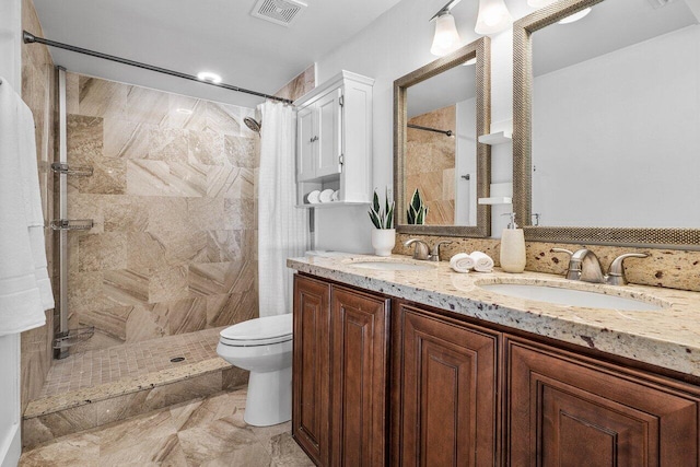 bathroom with a shower with shower curtain, vanity, and toilet