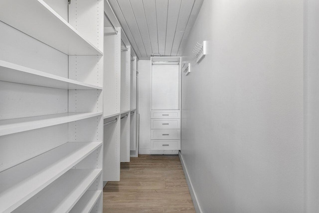 walk in closet featuring light hardwood / wood-style floors