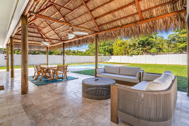 view of patio / terrace featuring a gazebo and ceiling fan