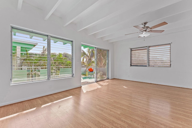 unfurnished room with beamed ceiling, light wood-type flooring, plenty of natural light, and ceiling fan