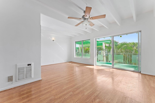 unfurnished room with heating unit, ceiling fan, light hardwood / wood-style flooring, and beamed ceiling