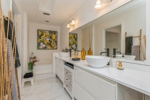 bathroom with a bathing tub and vanity