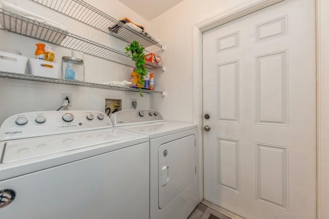 clothes washing area featuring washing machine and clothes dryer