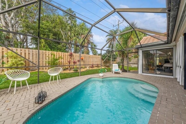 view of pool featuring a lanai and a patio area