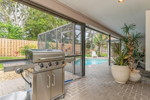 view of pool with a patio area and a lanai