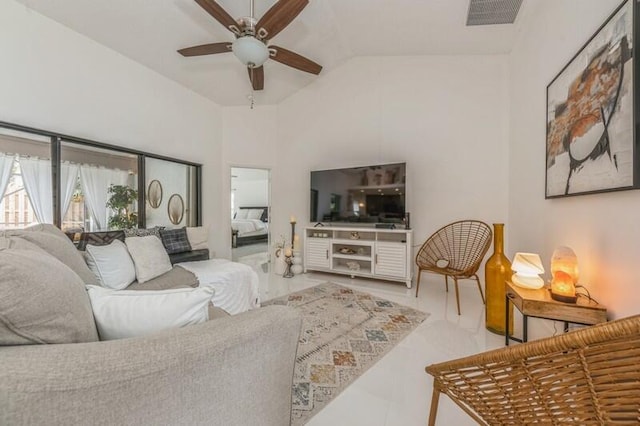 living room with ceiling fan and lofted ceiling