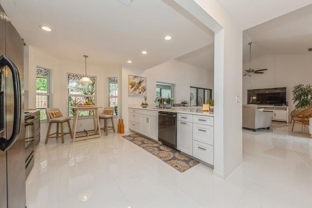 kitchen featuring white cabinets, lofted ceiling, black dishwasher, stainless steel fridge, and ceiling fan