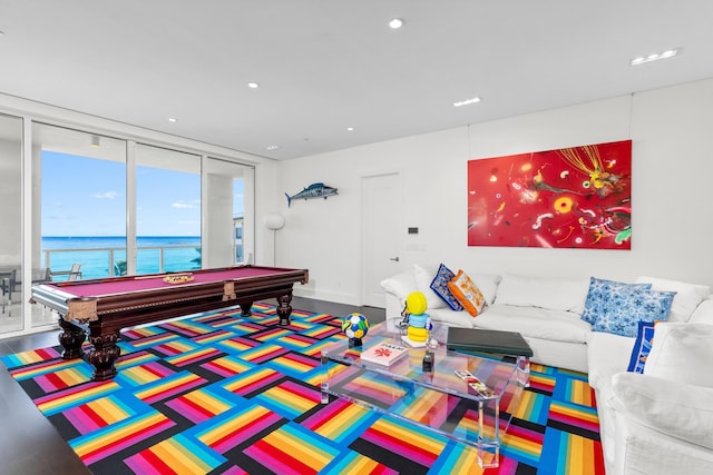 game room featuring expansive windows, a water view, and pool table