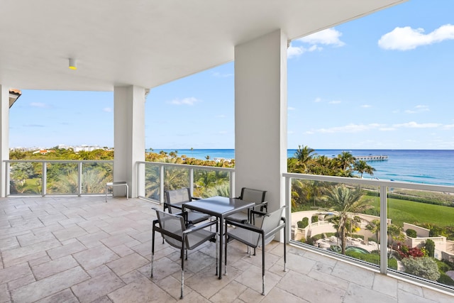 balcony with a beach view and a water view