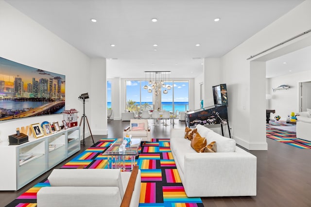 playroom featuring dark hardwood / wood-style floors and an inviting chandelier