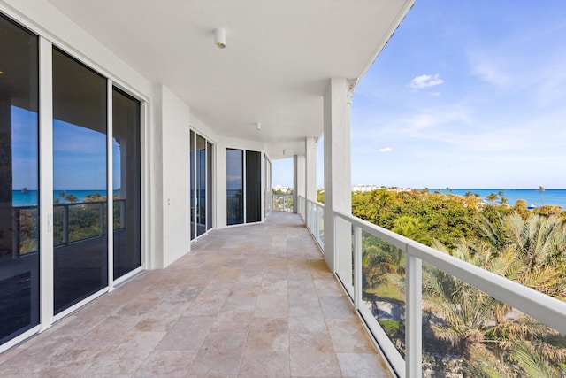 balcony featuring a water view