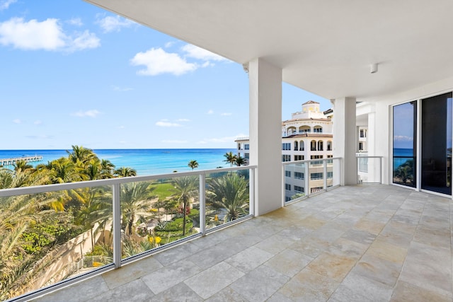 balcony featuring a water view