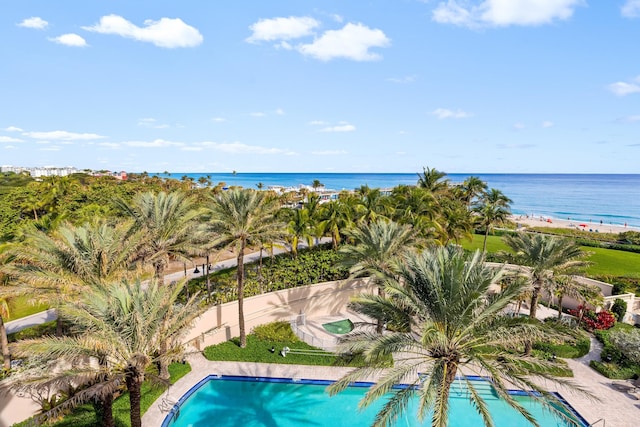 view of pool featuring a water view