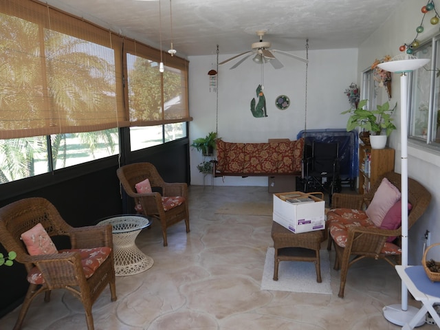 sunroom / solarium with ceiling fan