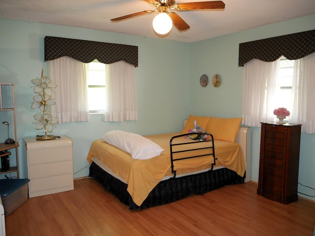 bedroom featuring ceiling fan and light wood-type flooring