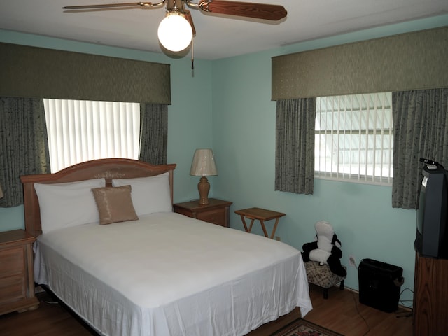 bedroom featuring ceiling fan and hardwood / wood-style floors