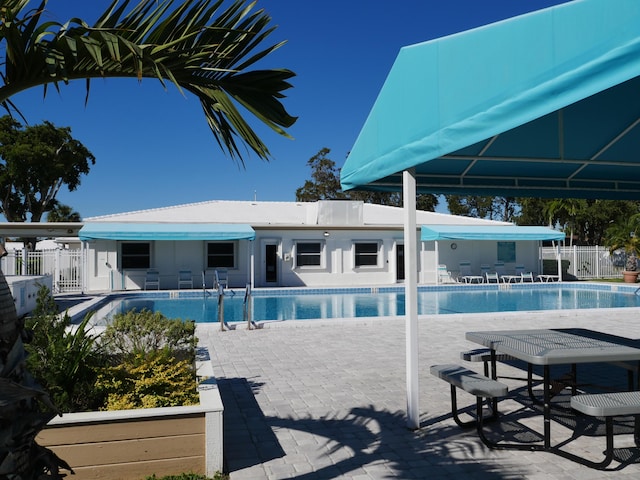 view of swimming pool with a patio