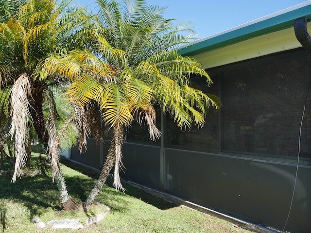 view of yard featuring a sunroom