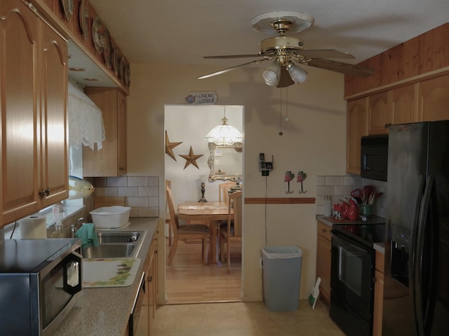 kitchen with ceiling fan, hanging light fixtures, black appliances, and tasteful backsplash