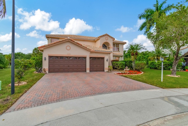 mediterranean / spanish-style house with a front lawn and a garage