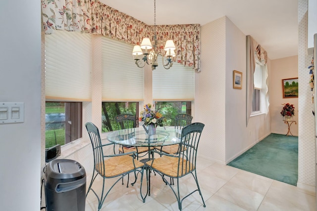 tiled dining room with an inviting chandelier