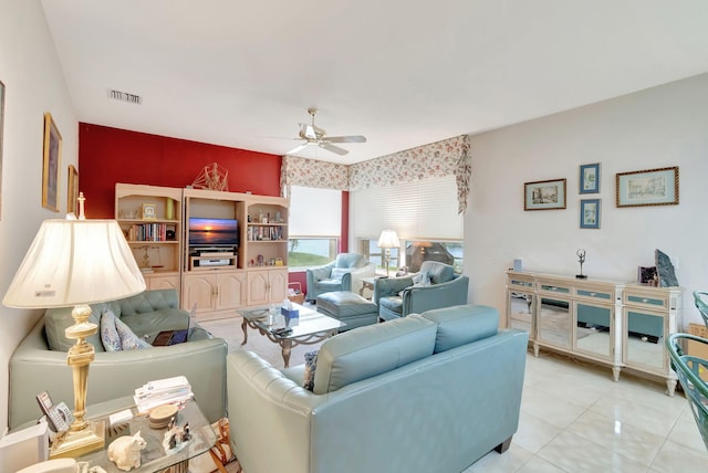 tiled living room featuring ceiling fan