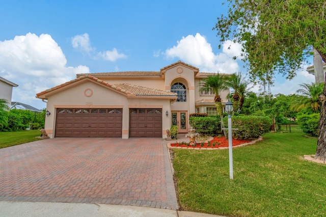 mediterranean / spanish-style home with french doors and a front lawn