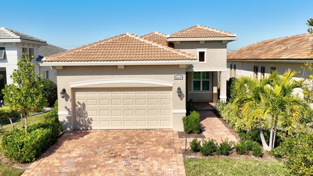 mediterranean / spanish-style home featuring a garage