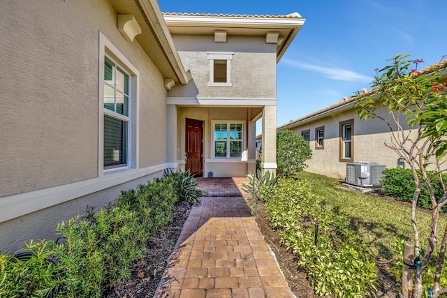 doorway to property featuring cooling unit