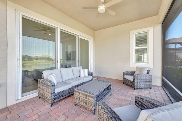 view of patio with ceiling fan and an outdoor living space