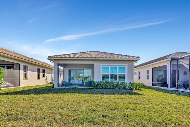 rear view of house with a yard