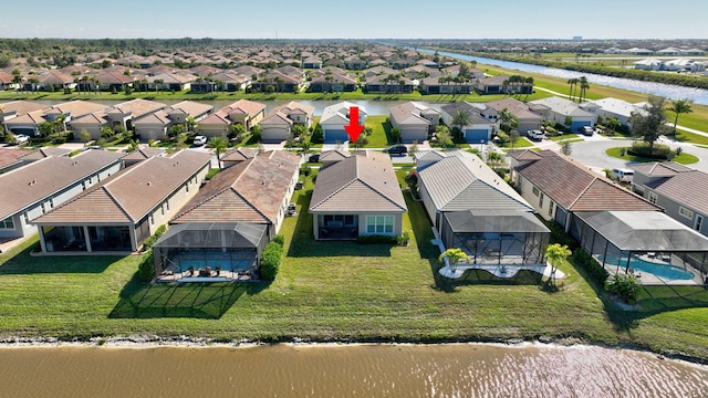 drone / aerial view featuring a water view