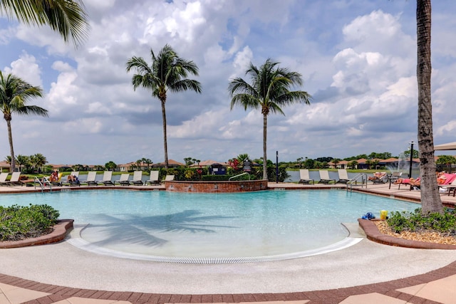 view of swimming pool featuring a patio area and pool water feature