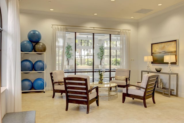 sitting room with crown molding