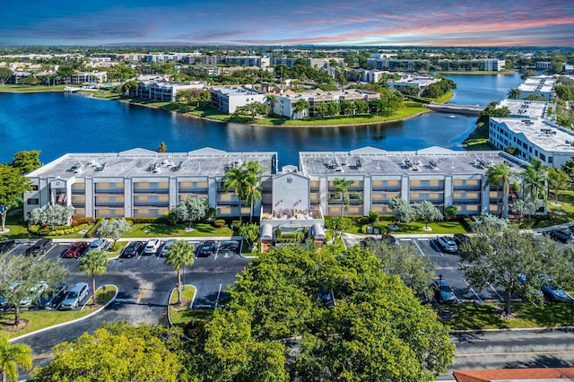 aerial view at dusk with a water view