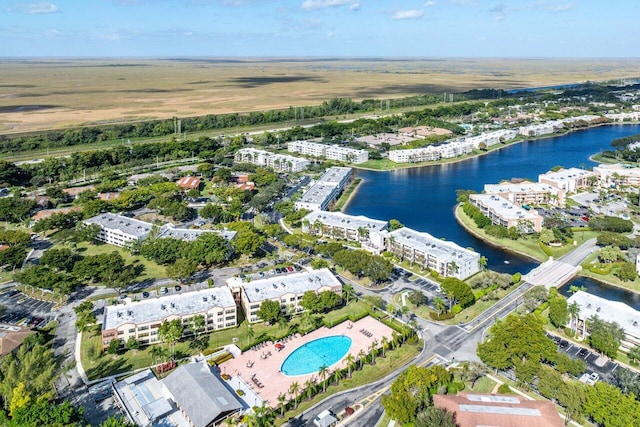 birds eye view of property with a water view