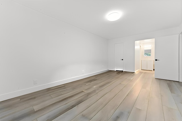 unfurnished room featuring light hardwood / wood-style floors