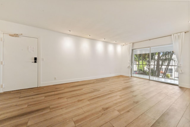 unfurnished room featuring light wood-type flooring