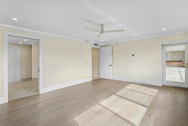 unfurnished room with ceiling fan, ornamental molding, and light wood-type flooring