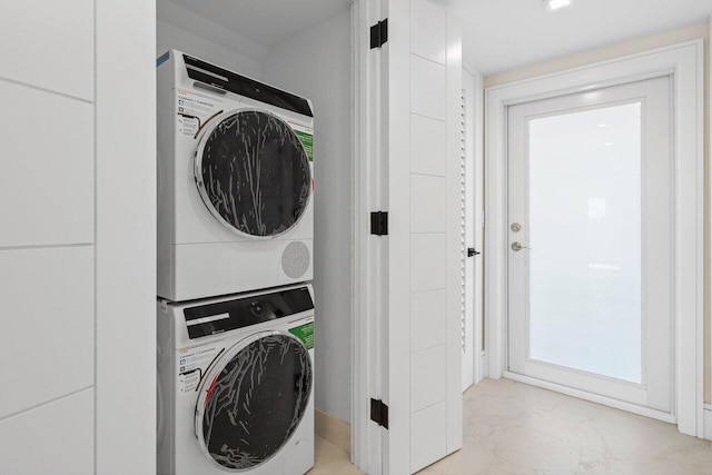 washroom with stacked washer / dryer