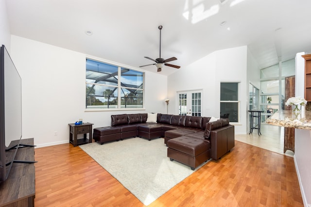living room featuring hardwood / wood-style floors, ceiling fan, and lofted ceiling