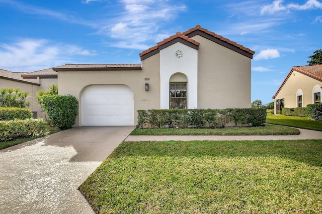 mediterranean / spanish-style house with a garage and a front lawn