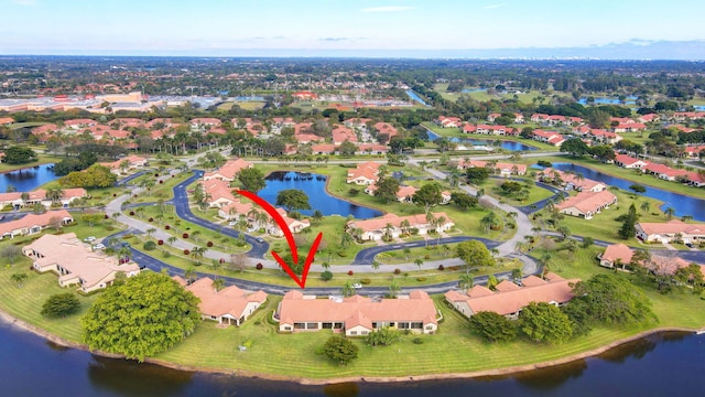 birds eye view of property featuring a water view