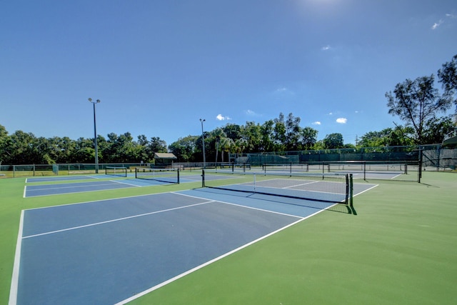 view of sport court with basketball hoop