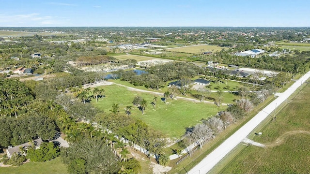 birds eye view of property with a rural view