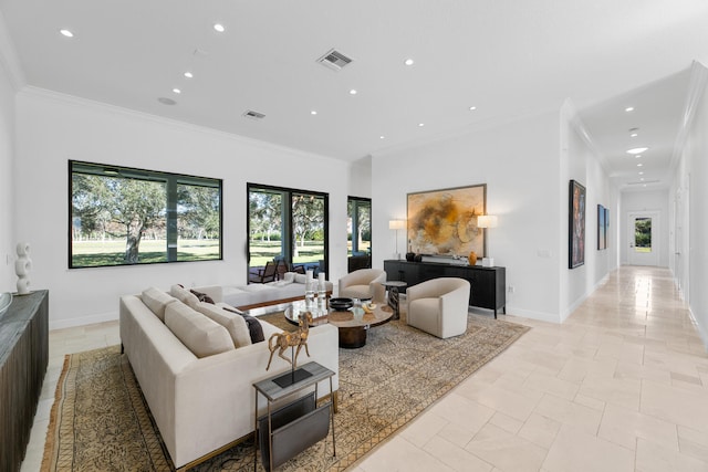 living room with plenty of natural light and crown molding