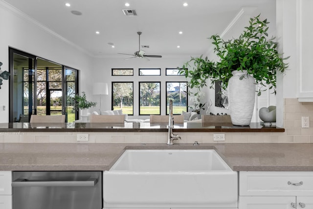 kitchen featuring white cabinets, dishwasher, sink, ceiling fan, and crown molding