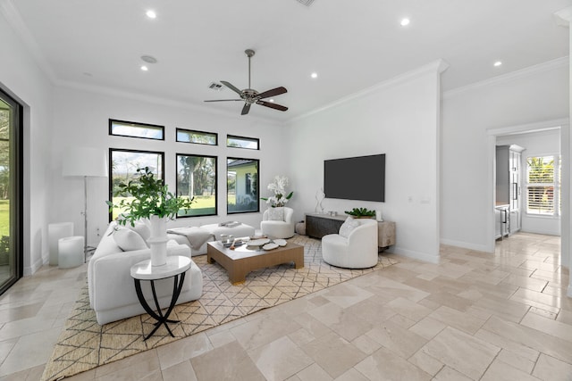 living room featuring ceiling fan and crown molding