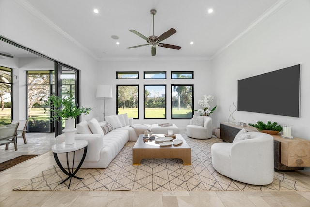 living room with ceiling fan and ornamental molding