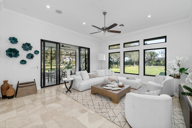 living room with ceiling fan and ornamental molding